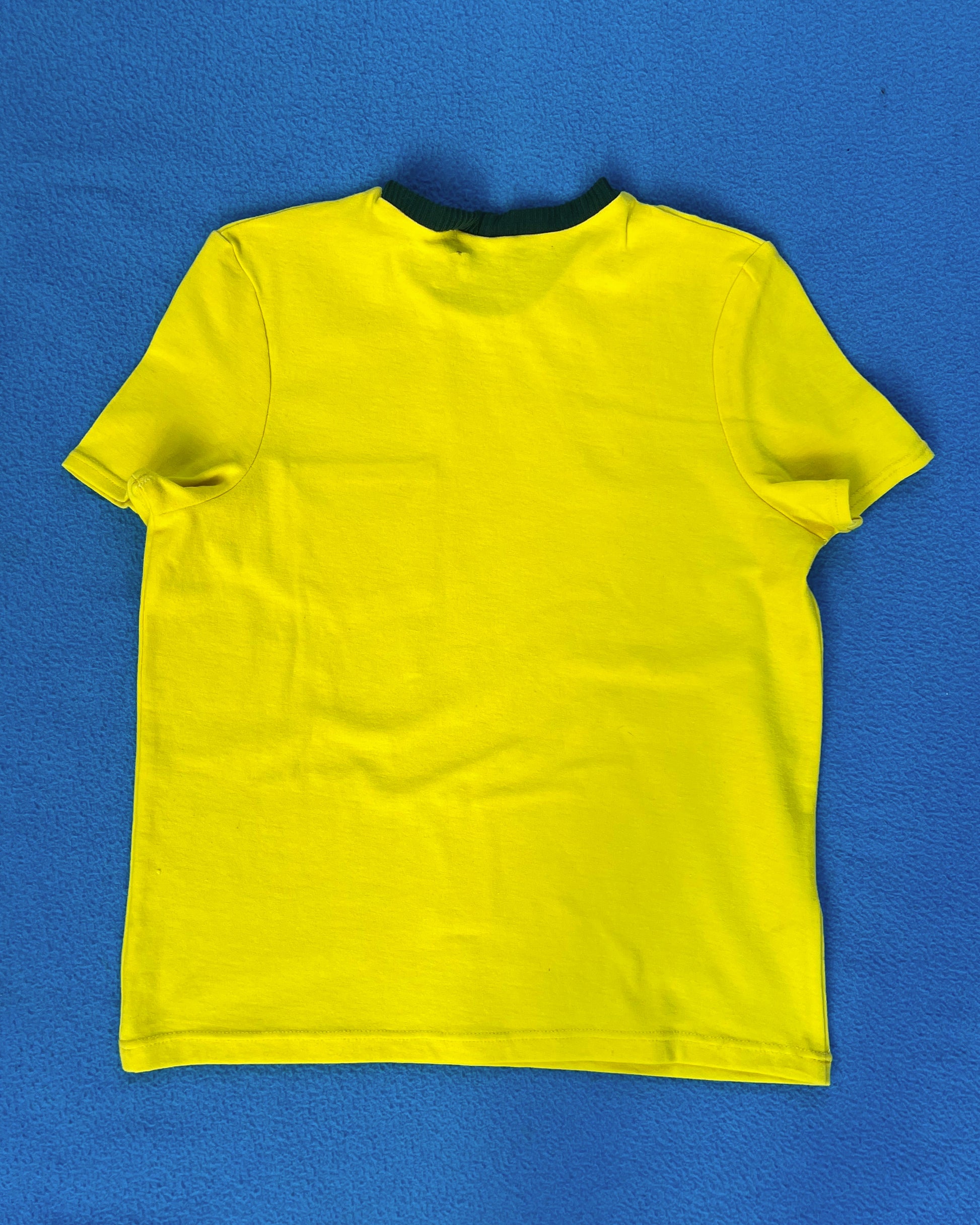 Yellow short sleeve shirt on a blue background